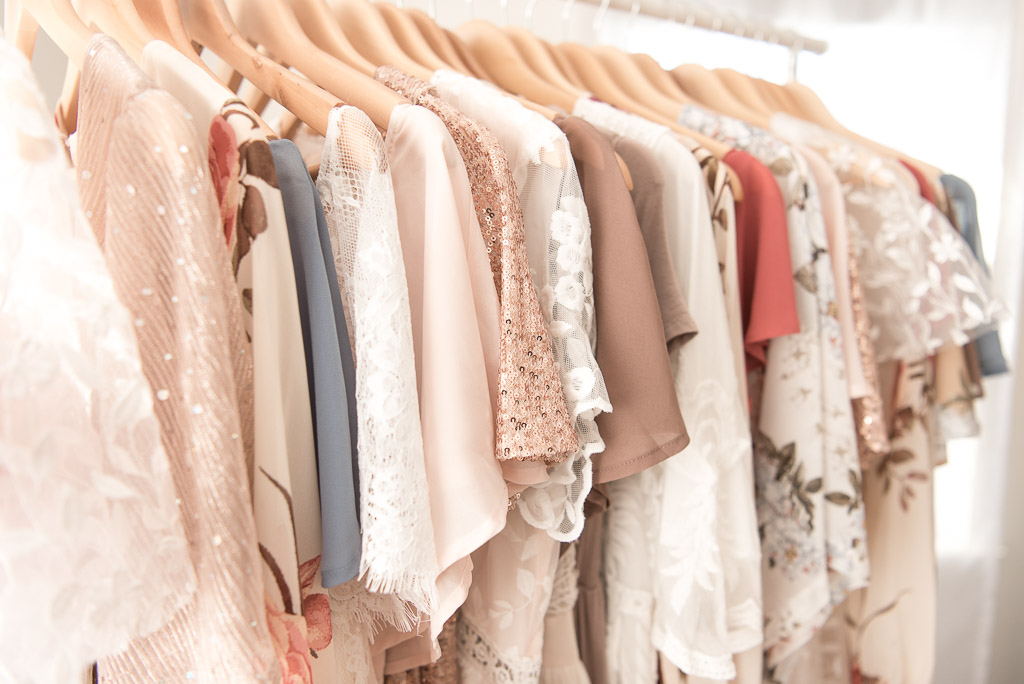 Close up of neutral colored dresses on hangers for Client Closet Sharon Leger Photography | Canton, CT Studio | Family and Newborn Photographer with Client Closet