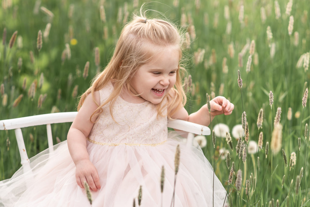 Little girl in field at mini session in Burlington, Connecticut
