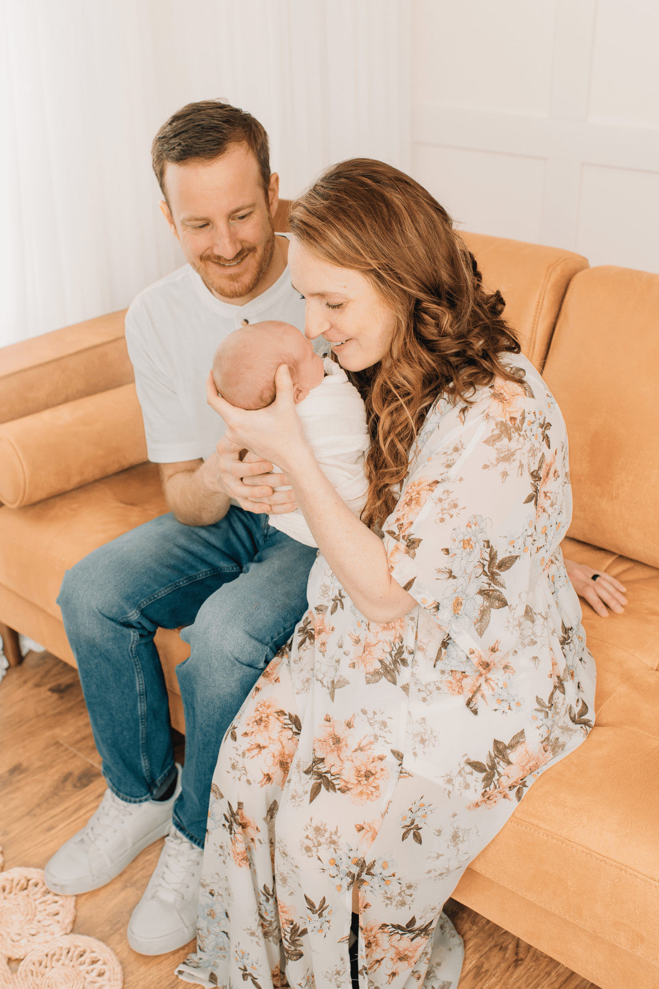 Mom smiling at her newborn baby boy at her newborn session with Sharon Leger Photography in Canton, Connecticut